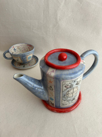 Théière "Ton coeur connait la réponse" avec tasse assortie.